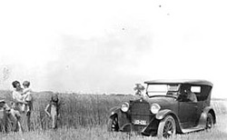 Mrs. Lola Baumberger and Children in Wheatfield, 1928, with Touring Car