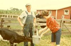Luke Bridger and Daughter Feeding Calf
