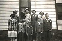 Hartke Family and House: (front row) Pat, Frank, Phil, Chuck and Jerry; (back row) Sally, Mike, Mary Lou, Margie, and Vera; 1952