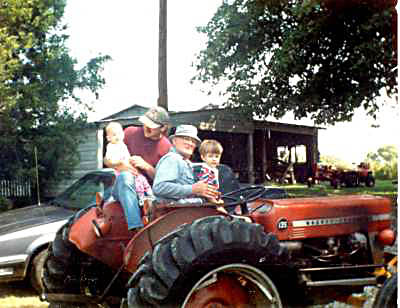 Three generations of Reids on a Massey-Ferguson tractor. Three generations of Reids on a Massey-Ferguson tractor.